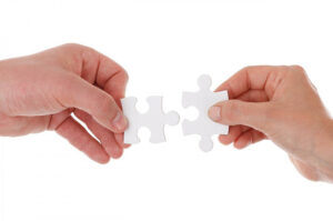 hand.puzzle.pieces-300×199